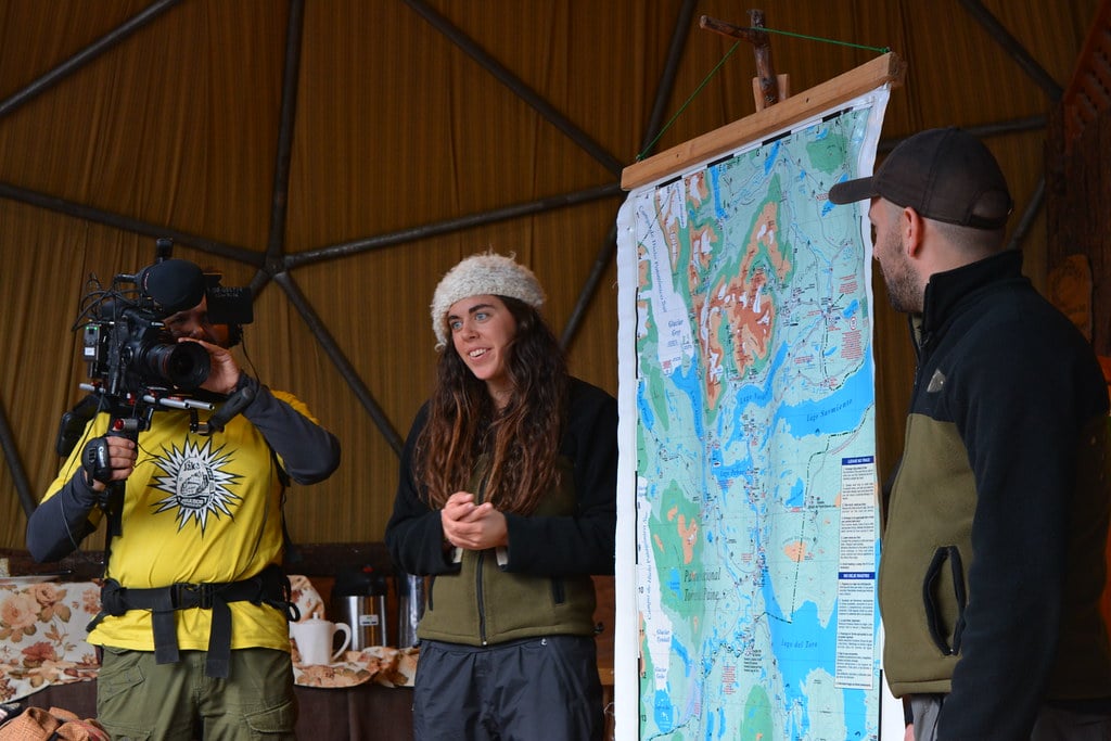 Johnny (camera operator) is filming during the evening briefing with the guides at Ecocamp.