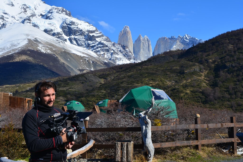 Johnny, the camera operator, is standing in front of EcoCamp.