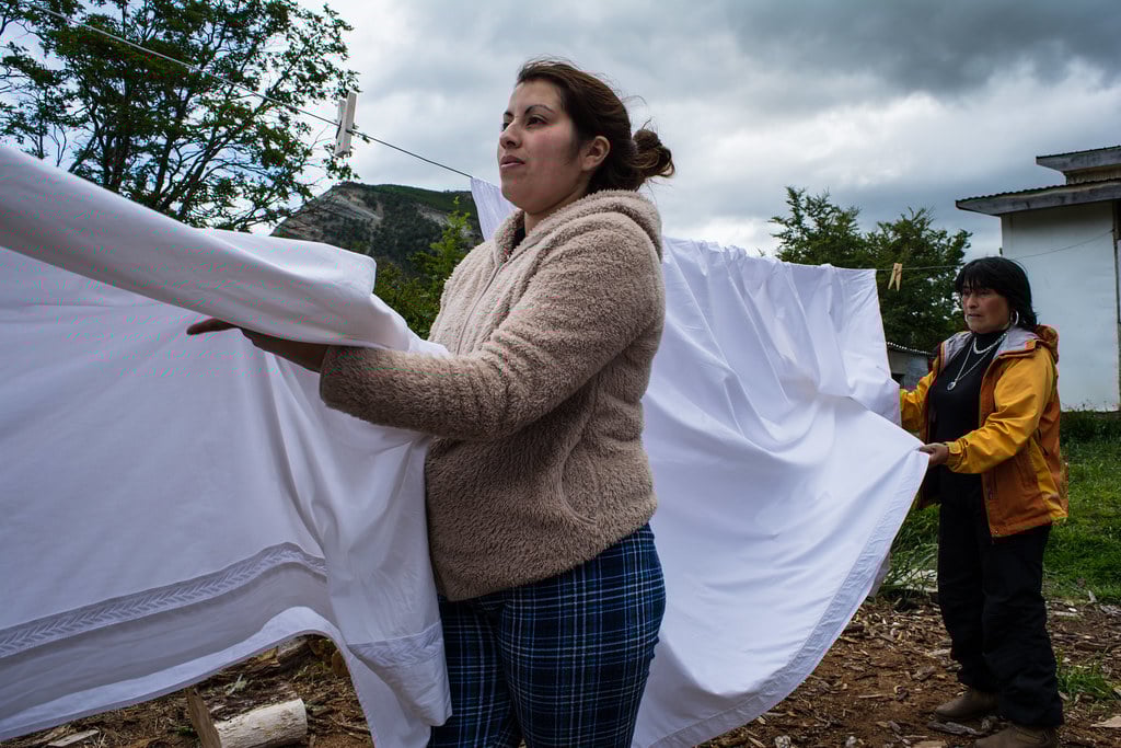 Mother and Daughter washing the sheets