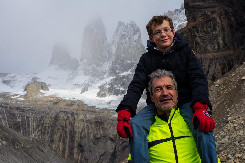 Family trekking in Torres del Paine, Chile