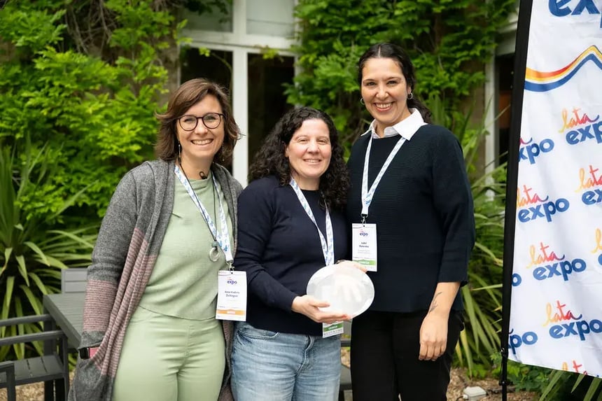 EcoCamp Patagonia team accepting the Gold Award for waste management at the LATA Expo 2025 in London.
